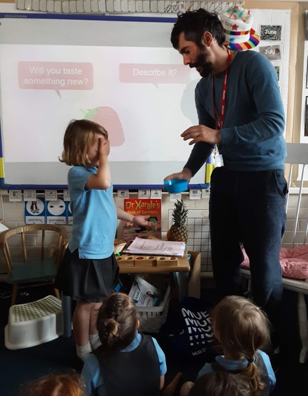 Bind's CEO Duncan Fairbrother with a student at Rockcliffe First School, doing blind tasting sessions.